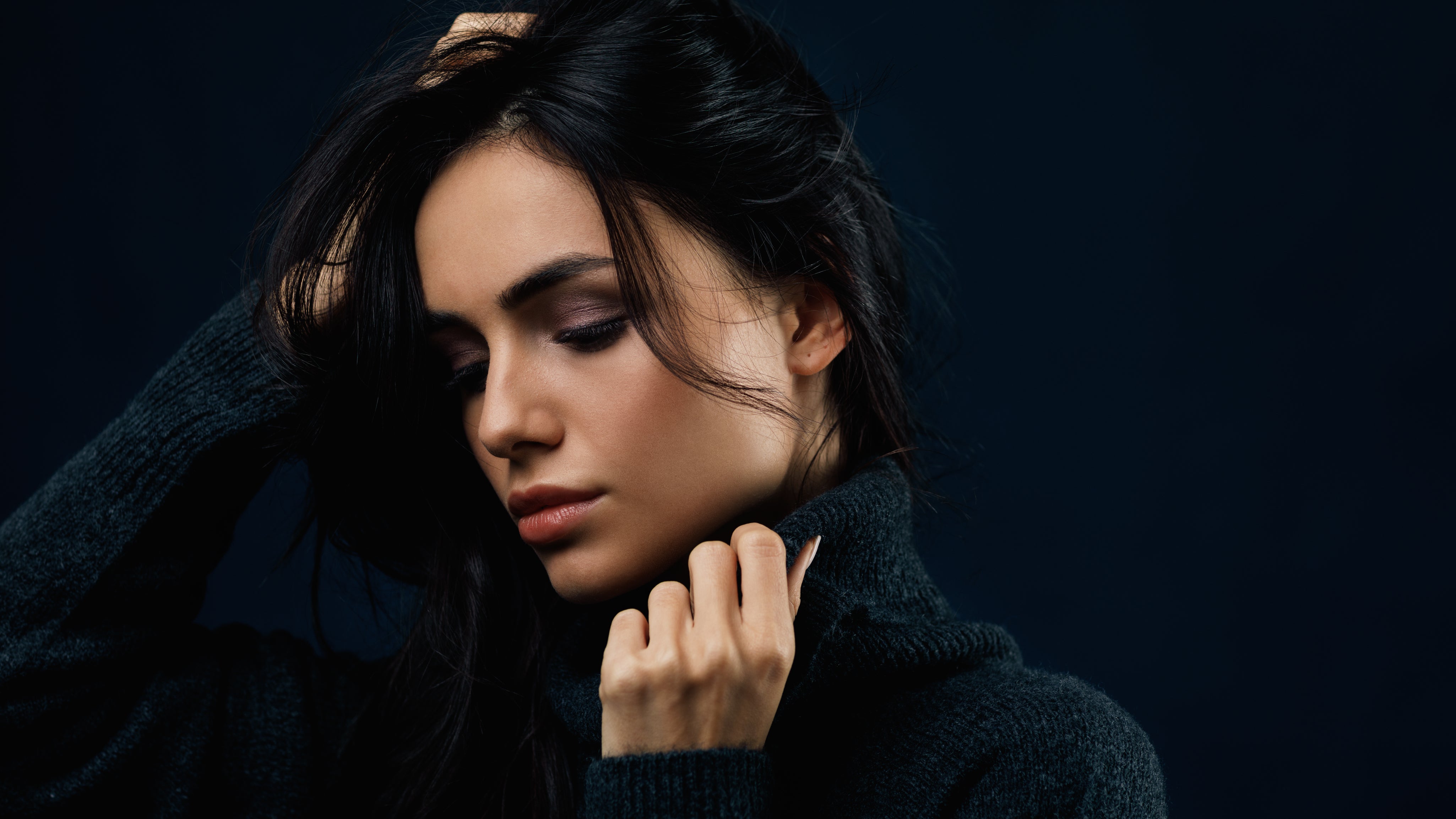 young-beautiful-woman-sweater-posing-studio.jpg